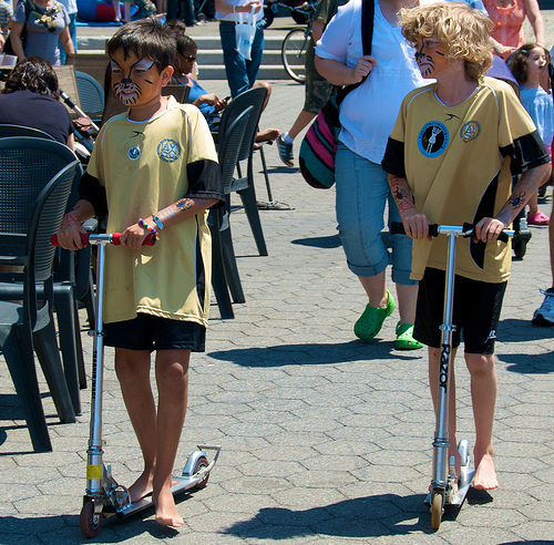 Kids on scooters in Riverside Park