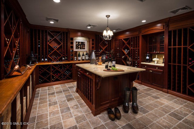 This Greenwich, CT home listed by Tamar Lurie features a wine room so big you could host a tasting party in it.