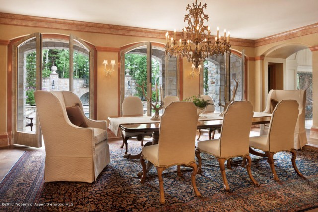 This regal dining room is fit for modern royalty. The head of every table should have a cozy arm chair to encourage hours lounging at the dining room table. This Aspen, CO hideaway is listed by Carrie Wells with Coldwell Banker Mason Morse.