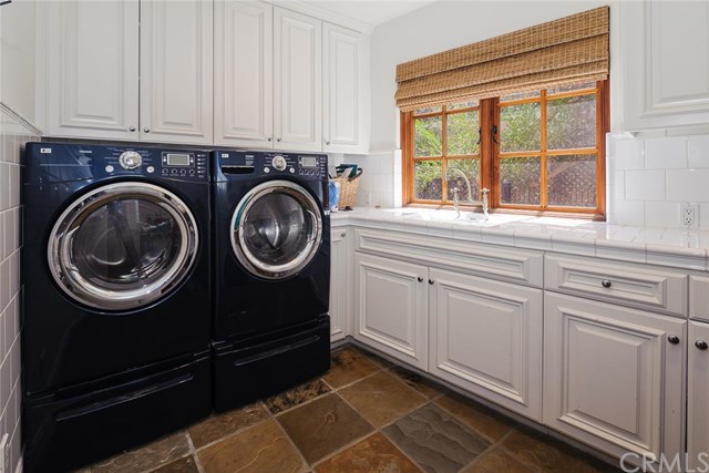 This Laguna Beach, CA home's laundry room shows that black is always in.