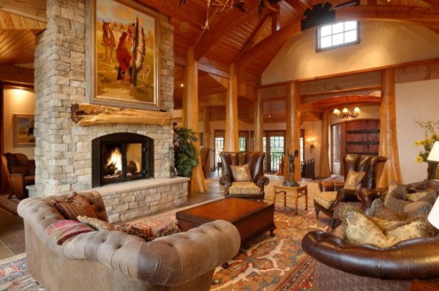 Soft leather seating, a roaring fireplace and soaring ceilings make this Glenwood Springs, CO lodge feel rustic and warm.