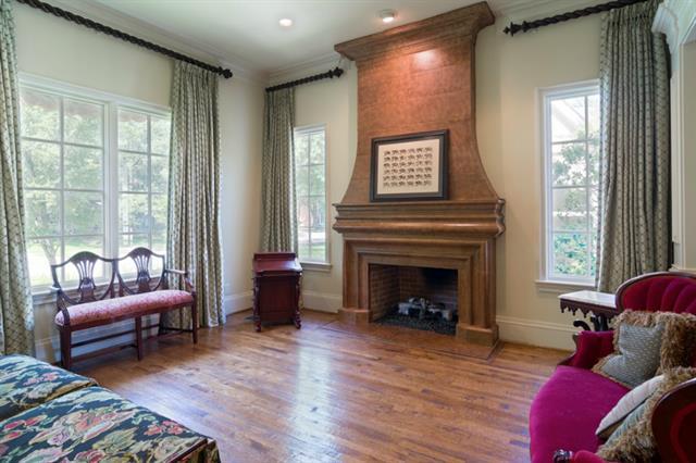 A classic oak-manteled fireplace gives this Highland Park home a classic look.