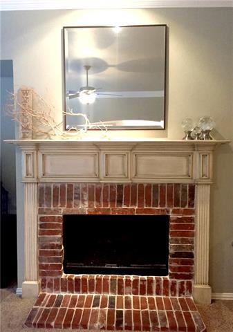 This Keller home features a gorgeous craftsman-style fireplace and mantel.