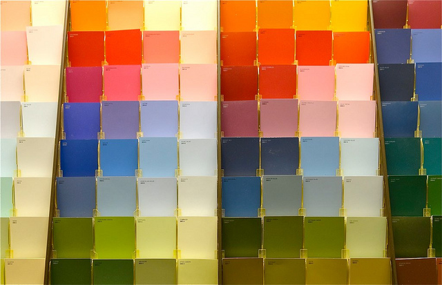Image of a row of paint swatches in a store