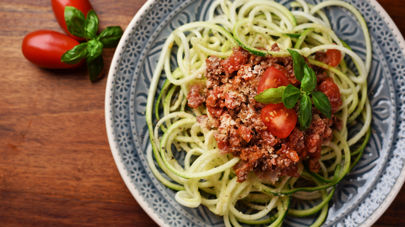Zucchini noodles called zoodles with vegan bolognese and yeast flakes – vegan, healthy food!