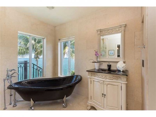Clawfoot tubs may be associated with an antique look, but this bathtub in this Miami Beach bathroom is nothing but fresh.  The black tub coupled with silver claw feet mixes old with new in a refreshing way.  Located at 831 N Venetian Dr, Miami Beach, FL this waterfront property is listed at $4,390,000 by Jill Hertzberg with Coldwell Banker Residential Real Estate.