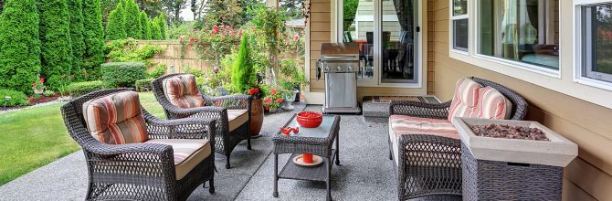 Cozy Covered Sitting Area With Wicker Chairs And Barbecue - Coldwell ...